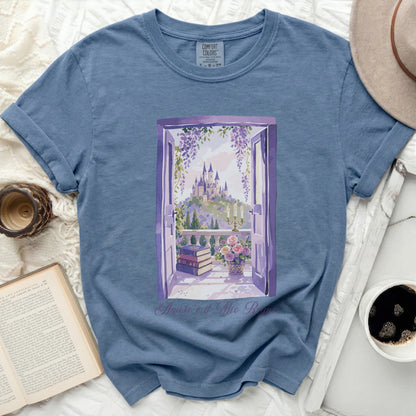 Blue t-shirt with "Amore è il Mio Regno" and castle window scene.