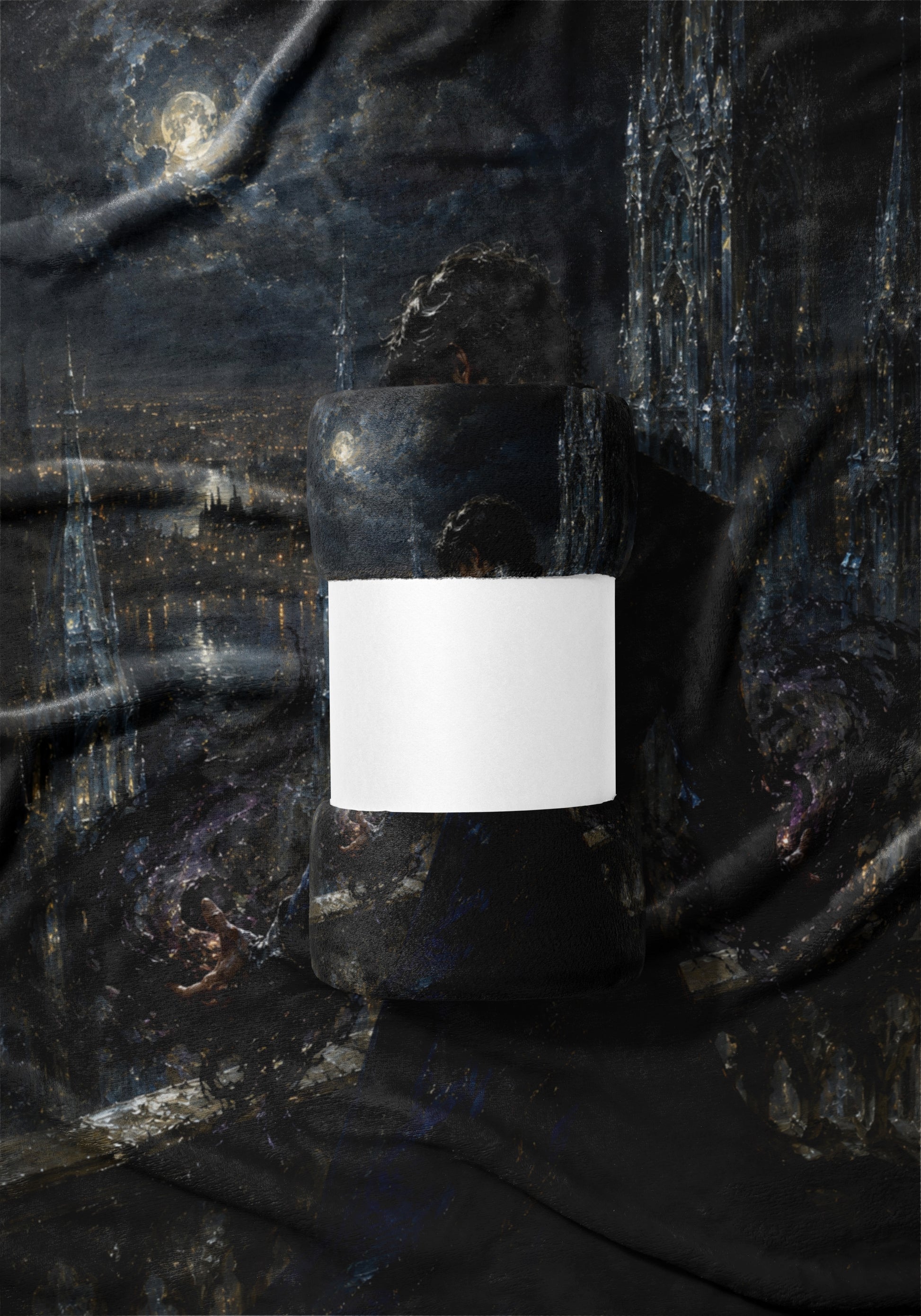 Rolled blanket with a dark, painterly city and moon scene, featuring a white band.