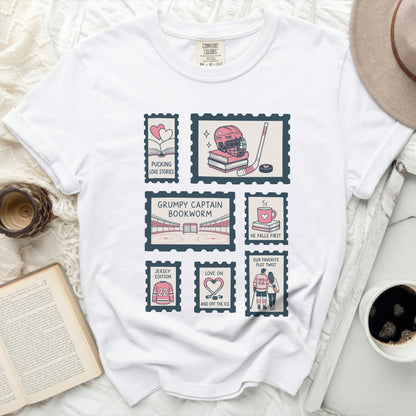 White t-shirt with "Pucking Love Bookworm" stamp graphic and hockey themes.