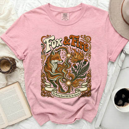 Pink t-shirt with "Fox & Fire" graphic and fox, fire, thistles, and ferns.