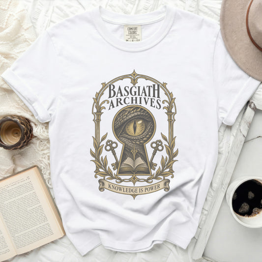 White t-shirt with Basgiath Archives dragon eye keyhole design and "Knowledge is Power" text.