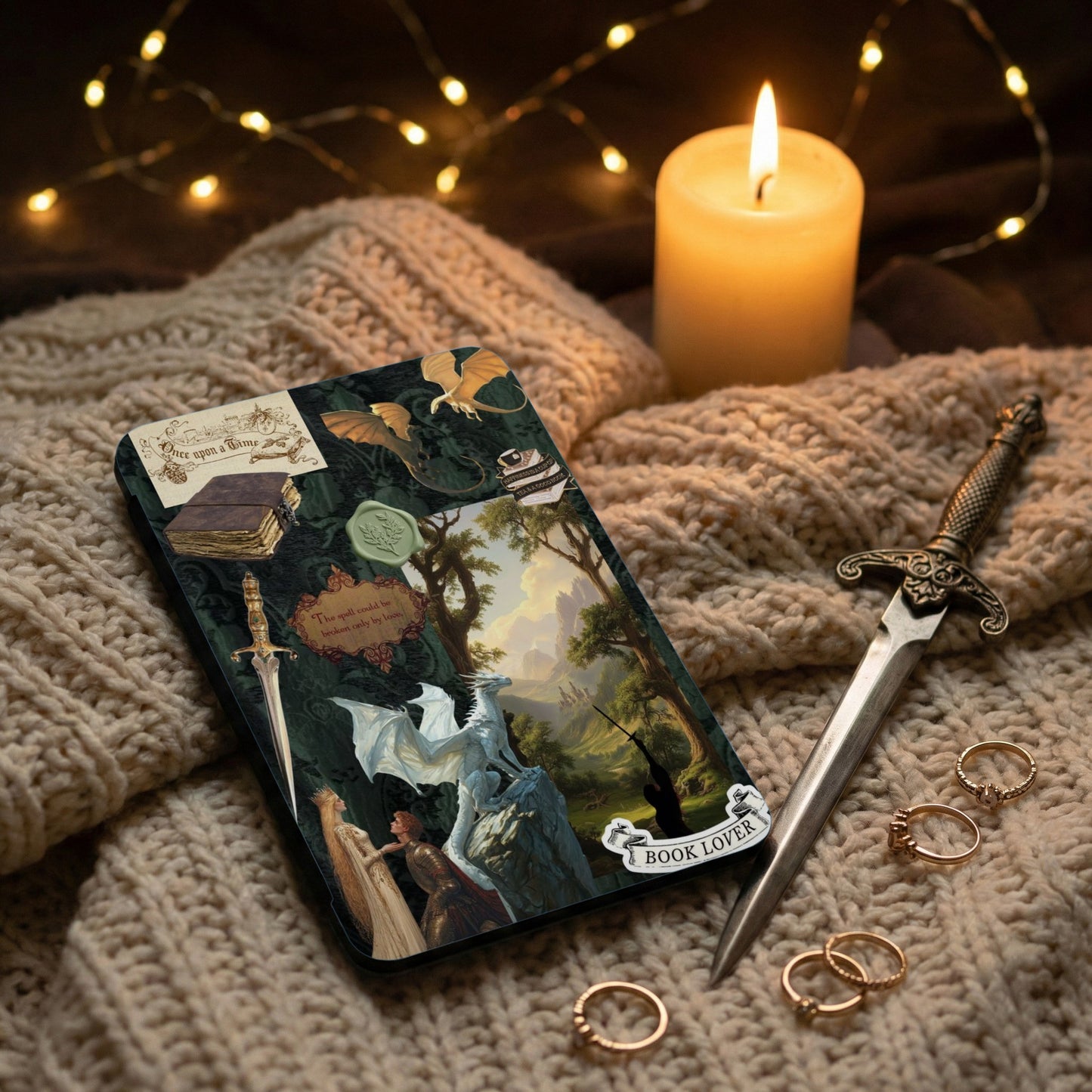 Fantasy journal with dragons, a white dragon, knights, and text that reads "Book Lover".