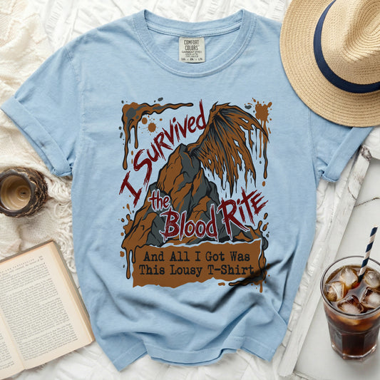 Light blue t-shirt with "I Survived the Blood Rite And All I Got Was This Lousy T-Shirt" graphic.