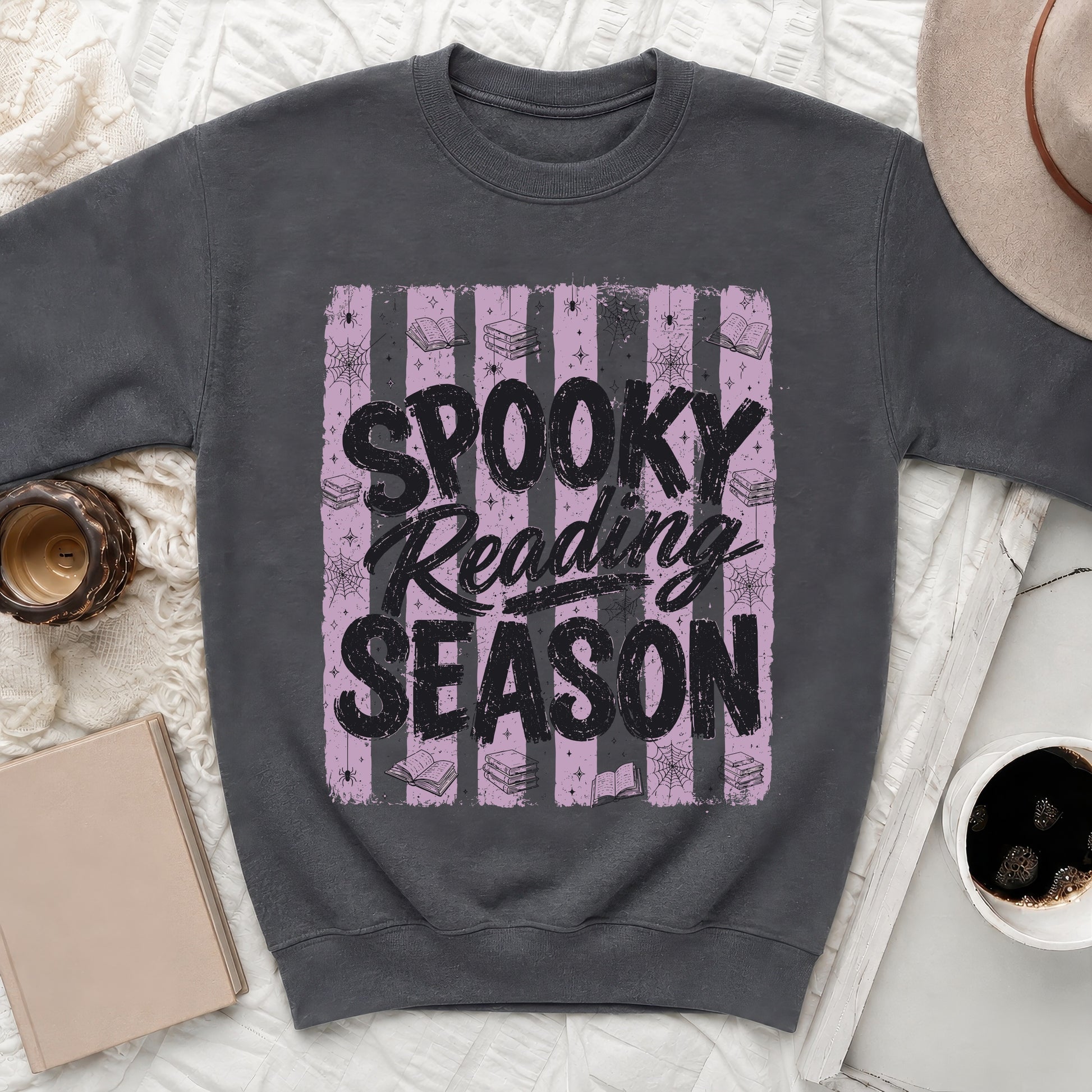 Dark grey sweatshirt with "Spooky Reading Season" text and Halloween-themed graphics.