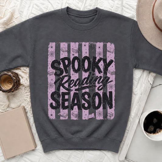 Dark grey sweatshirt with "Spooky Reading Season" text and Halloween-themed graphics.