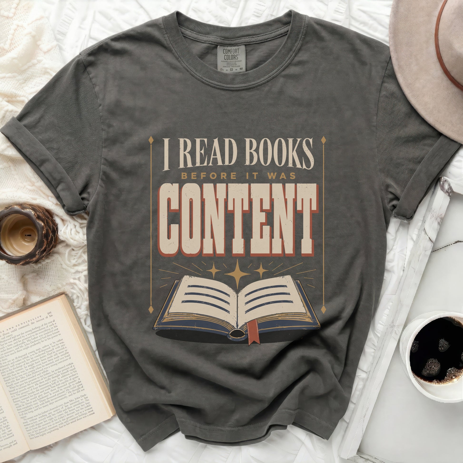 "I Read Books Before It Was Content" graphic t-shirt with open book design.