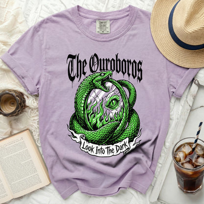 Purple t-shirt with a green serpent eating its tail design and text "The Ouroboros" and "Look Into The Dark".