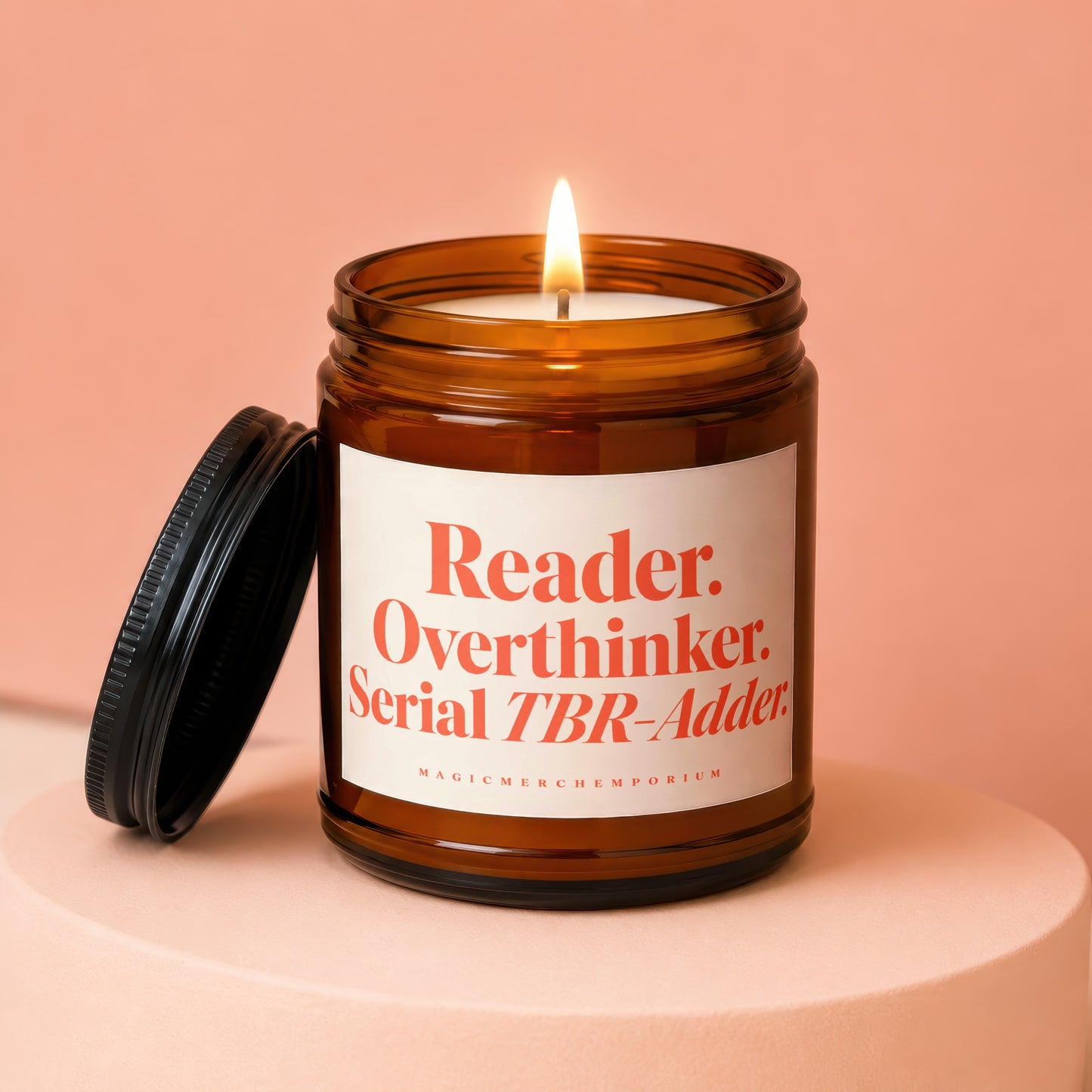 Burning candle in amber jar with "Reader. Overthinker. Serial TBR-Adder." text.
