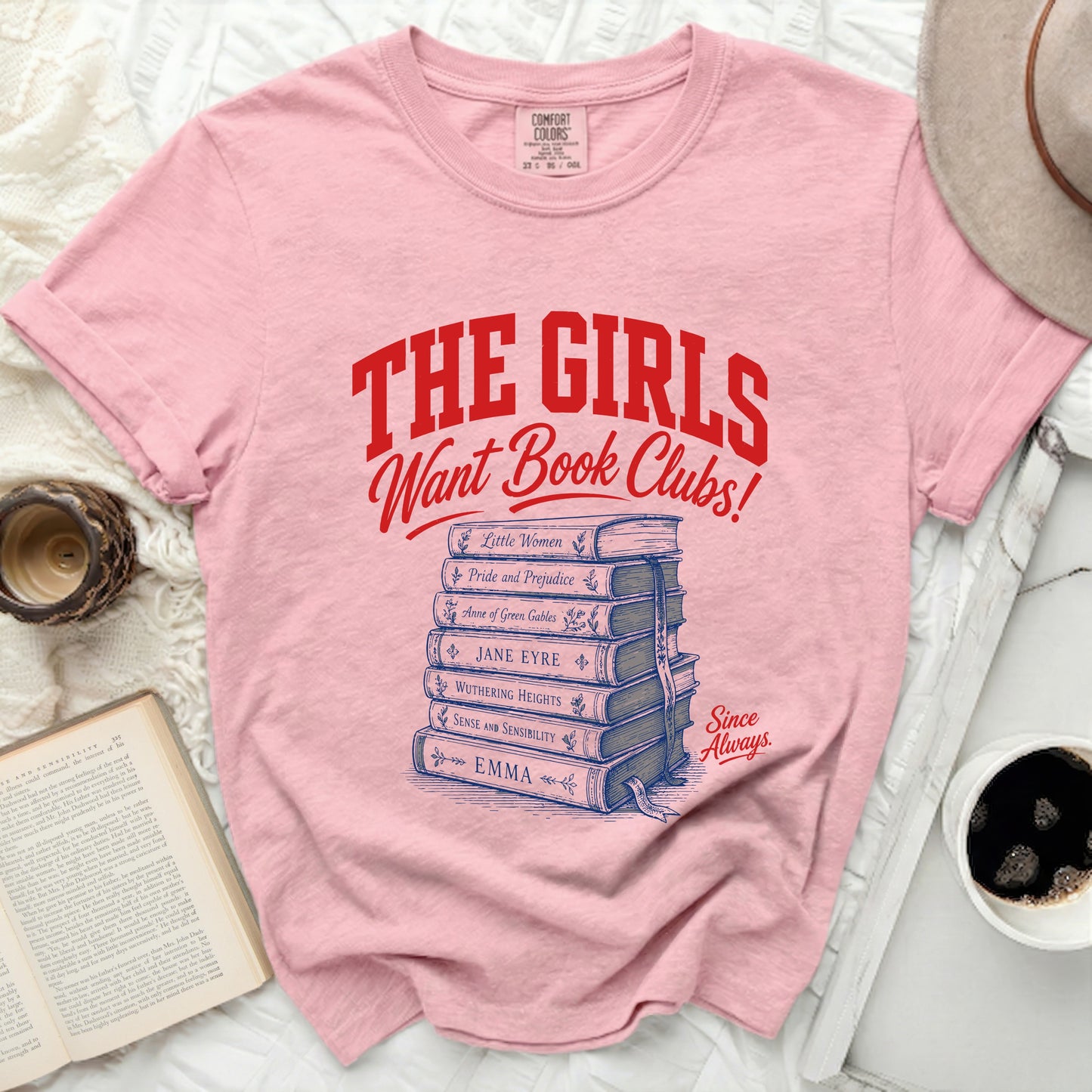 Pink t-shirt with "The Girls Want Book Clubs!" and book titles.