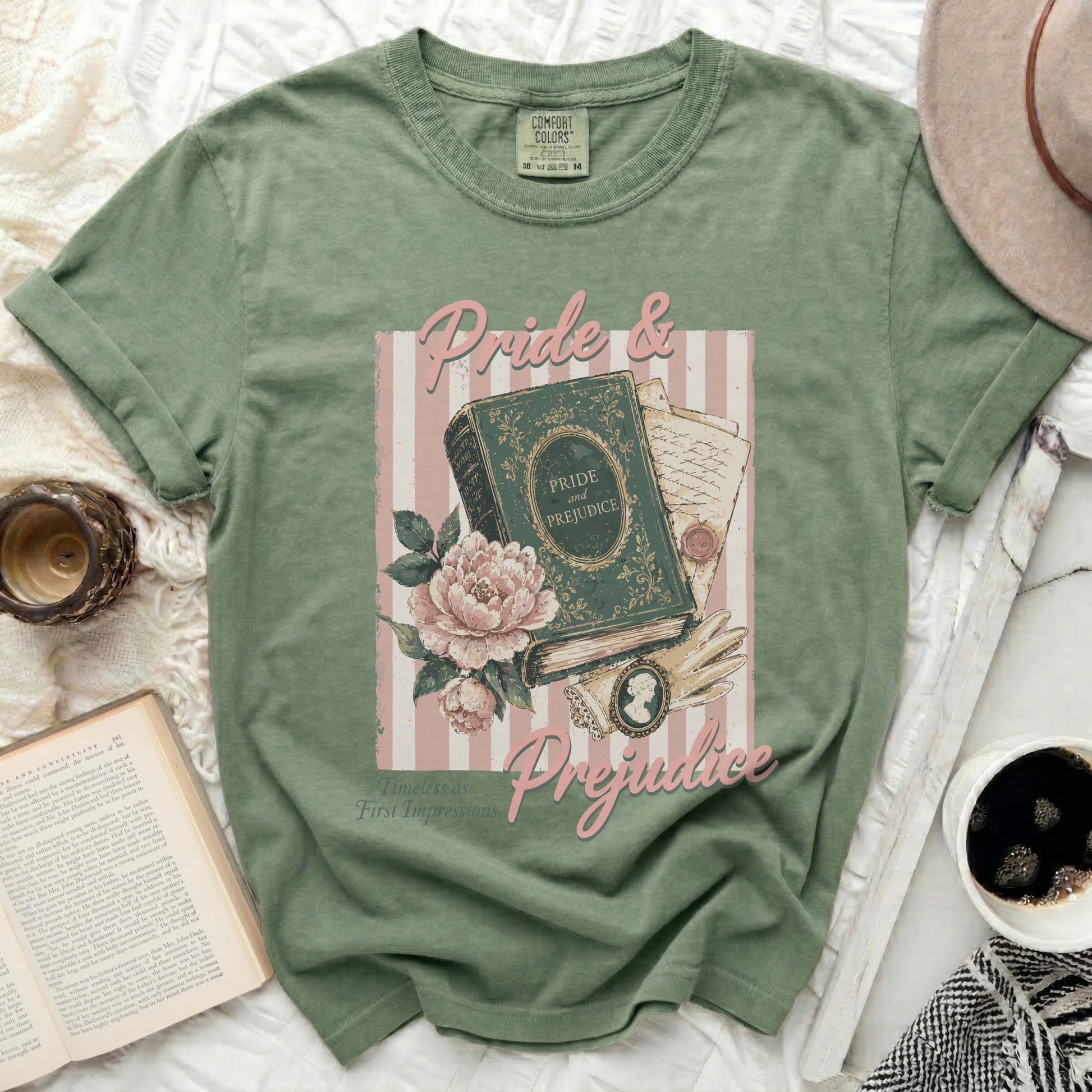 Green t-shirt with "Pride & Prejudice" graphic featuring a book, flowers, and cameo.