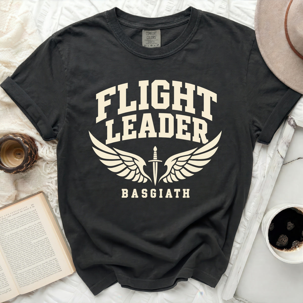 Black t-shirt with cream text "FLIGHT LEADER BASGIATH" and wings with a sword.