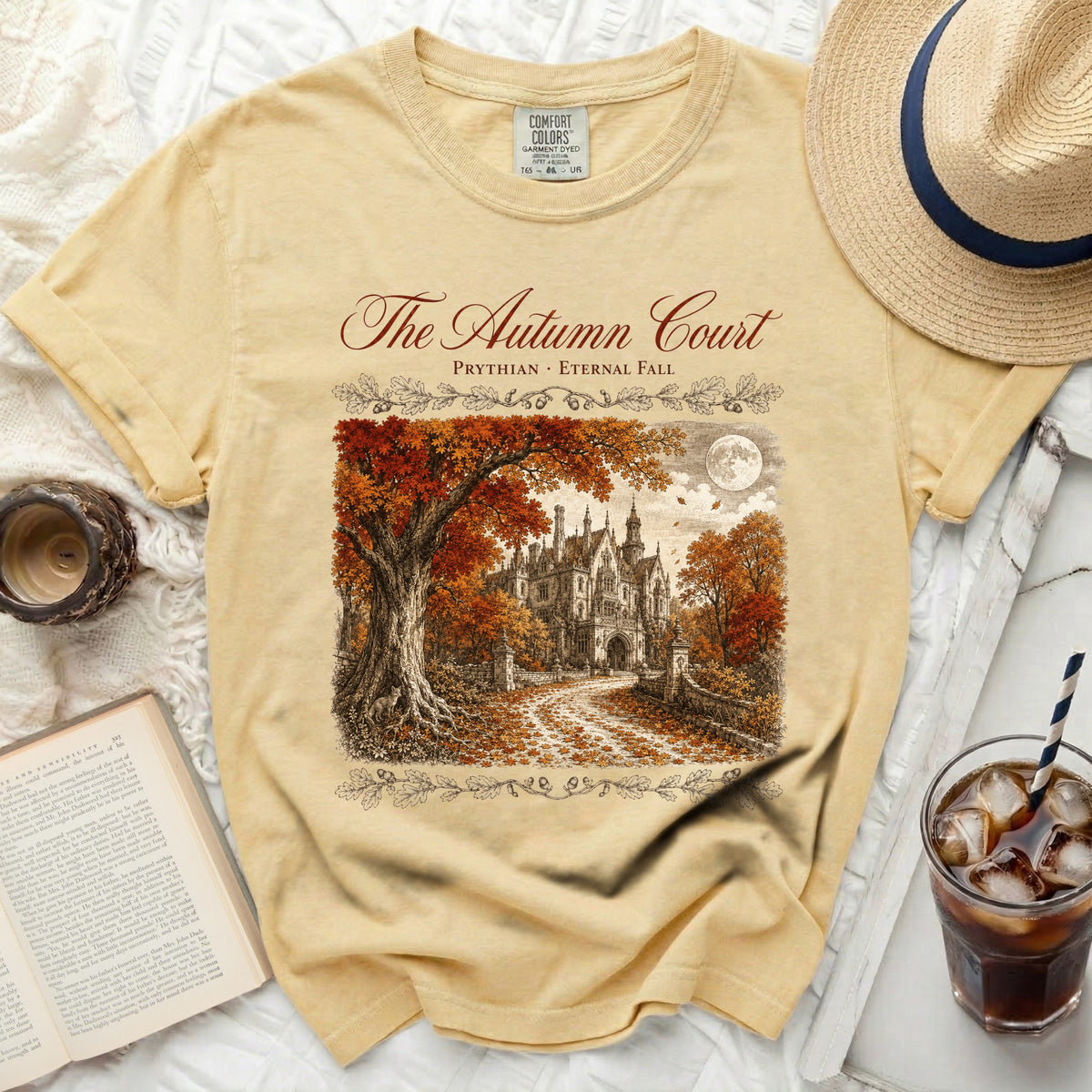 Yellow t-shirt with "The Autumn Court" graphic of a gothic mansion.