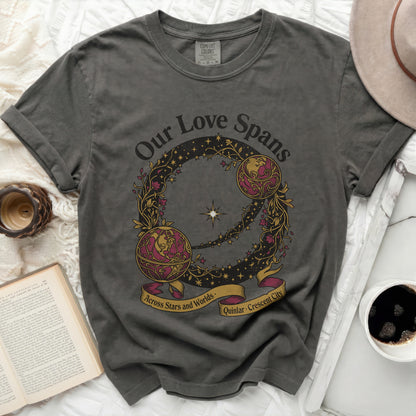 Dark gray t-shirt with "Our Love Spans Across Stars and Worlds, Quinlar Crescent City" text.