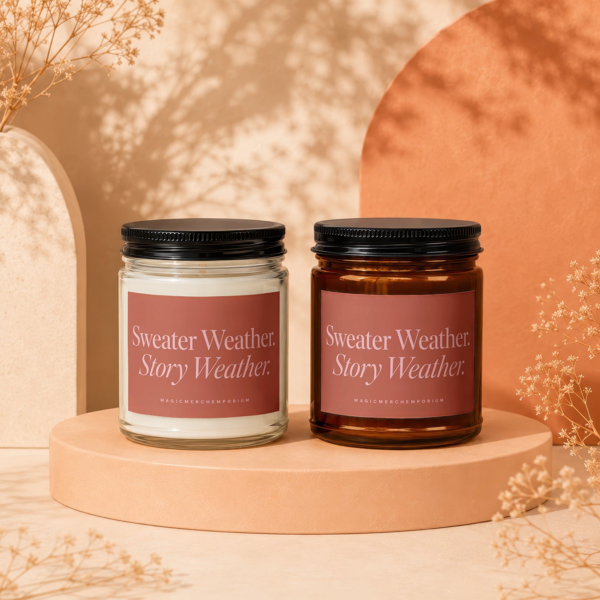 Two candles labeled "Sweater Weather. Story Weather." on a display pedestal.