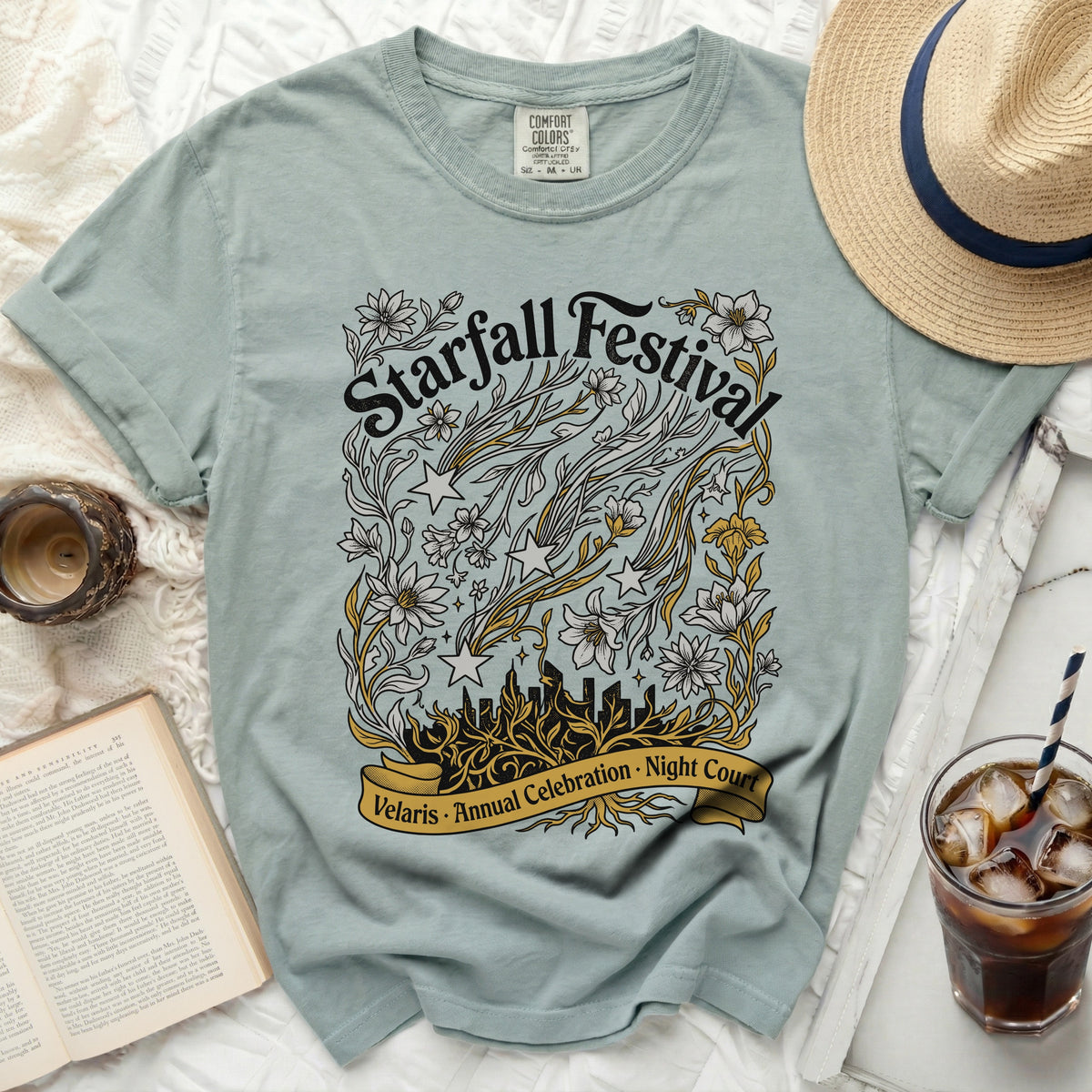 Light blue t-shirt with "Starfall Festival Velaris Annual Celebration Night Court" graphic.