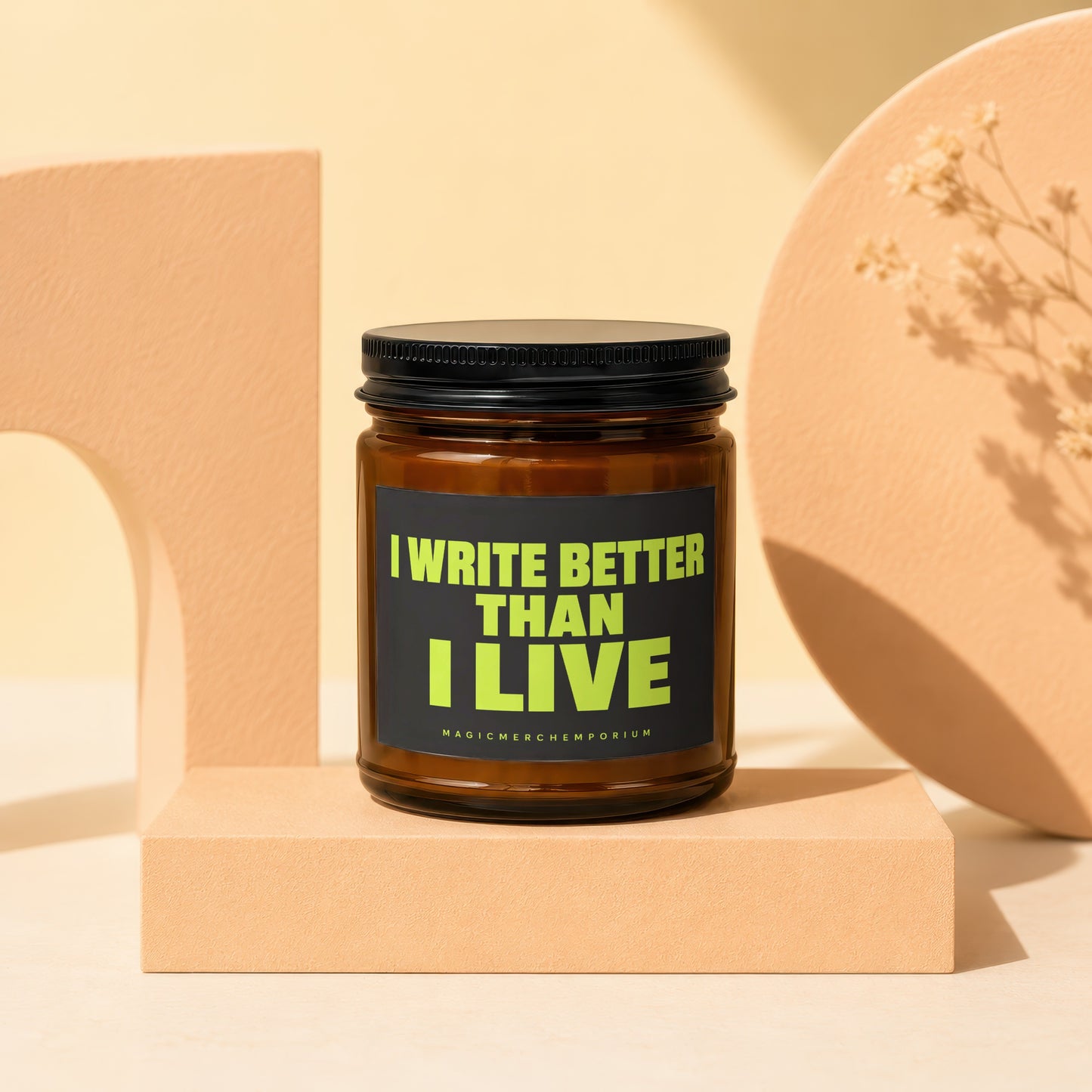 Amber jar candle with black lid and label that reads "I WRITE BETTER THAN I LIVE".