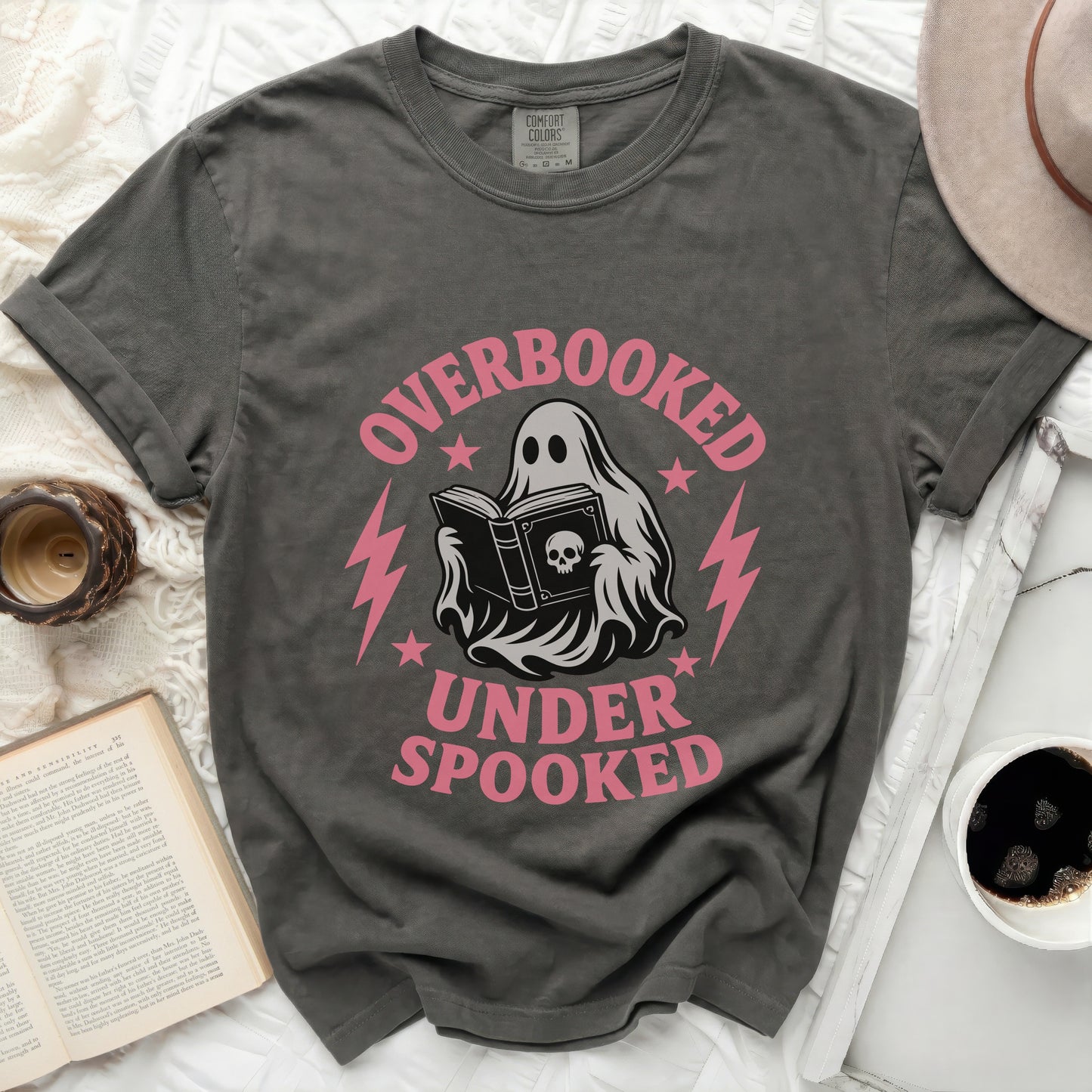 Ghost reading book with "Overbooked Under Spooked" text.