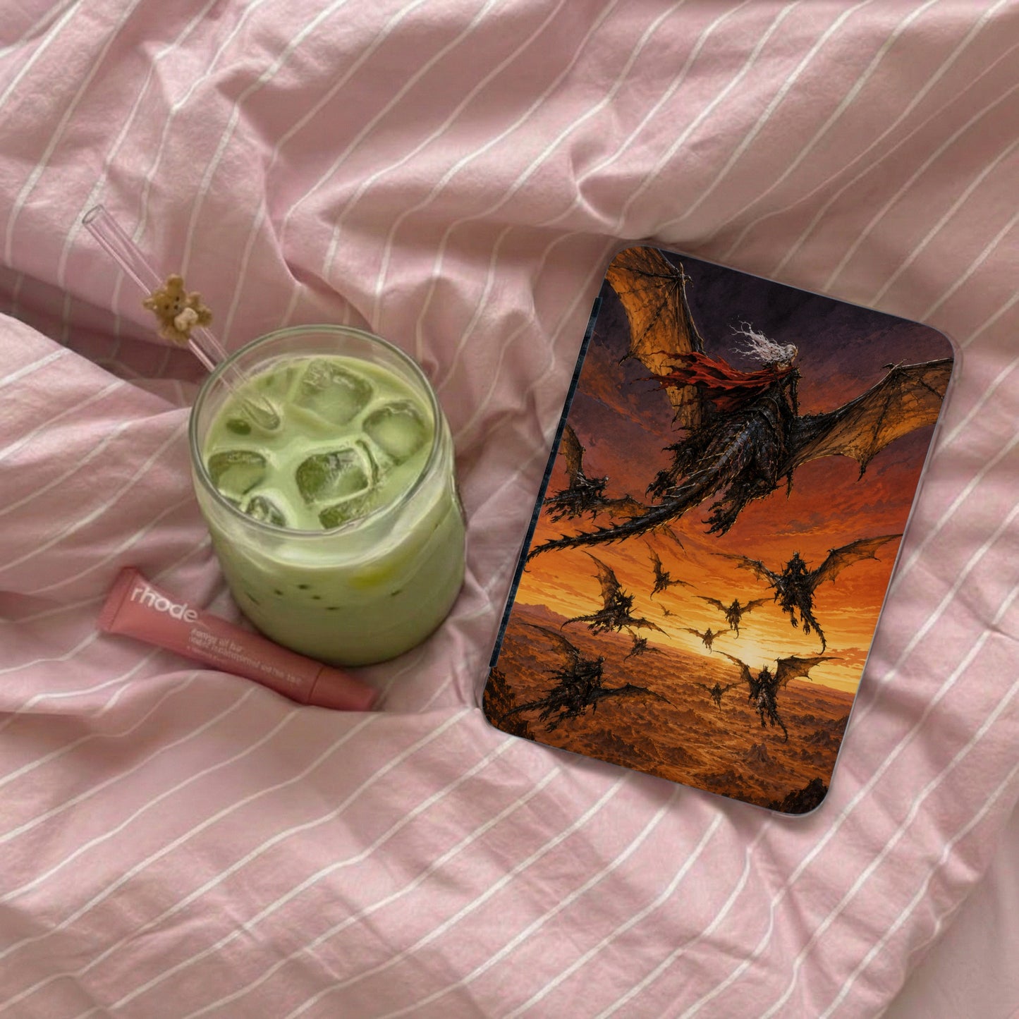 A dragon rider leads a horde of dragons across an orange, rocky landscape.