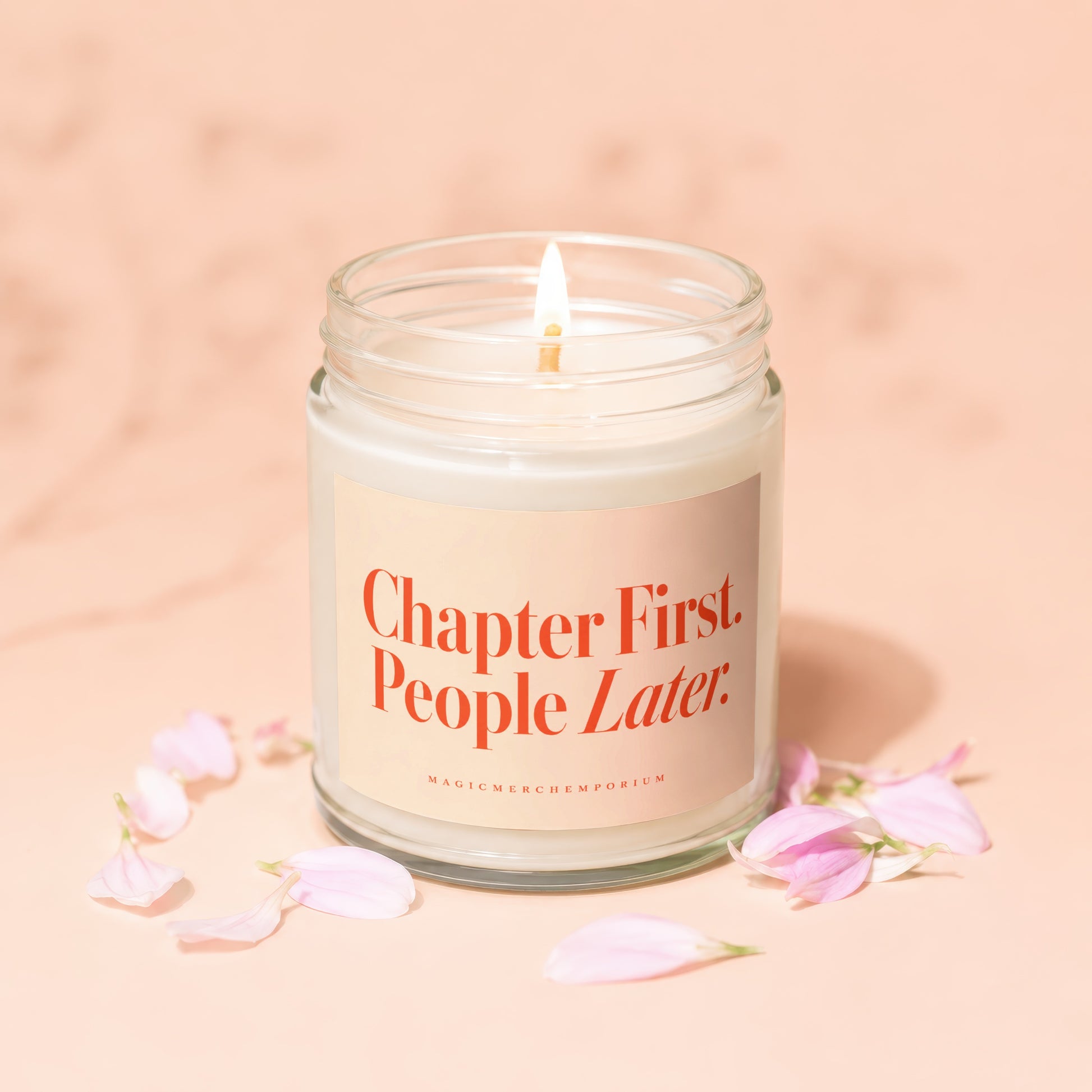 Glass jar candle with lit wick and "Chapter First. People Later." text.