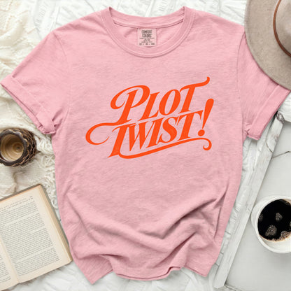 Pink Comfort Colors t-shirt with "PLOT TWIST!" graphic in orange.