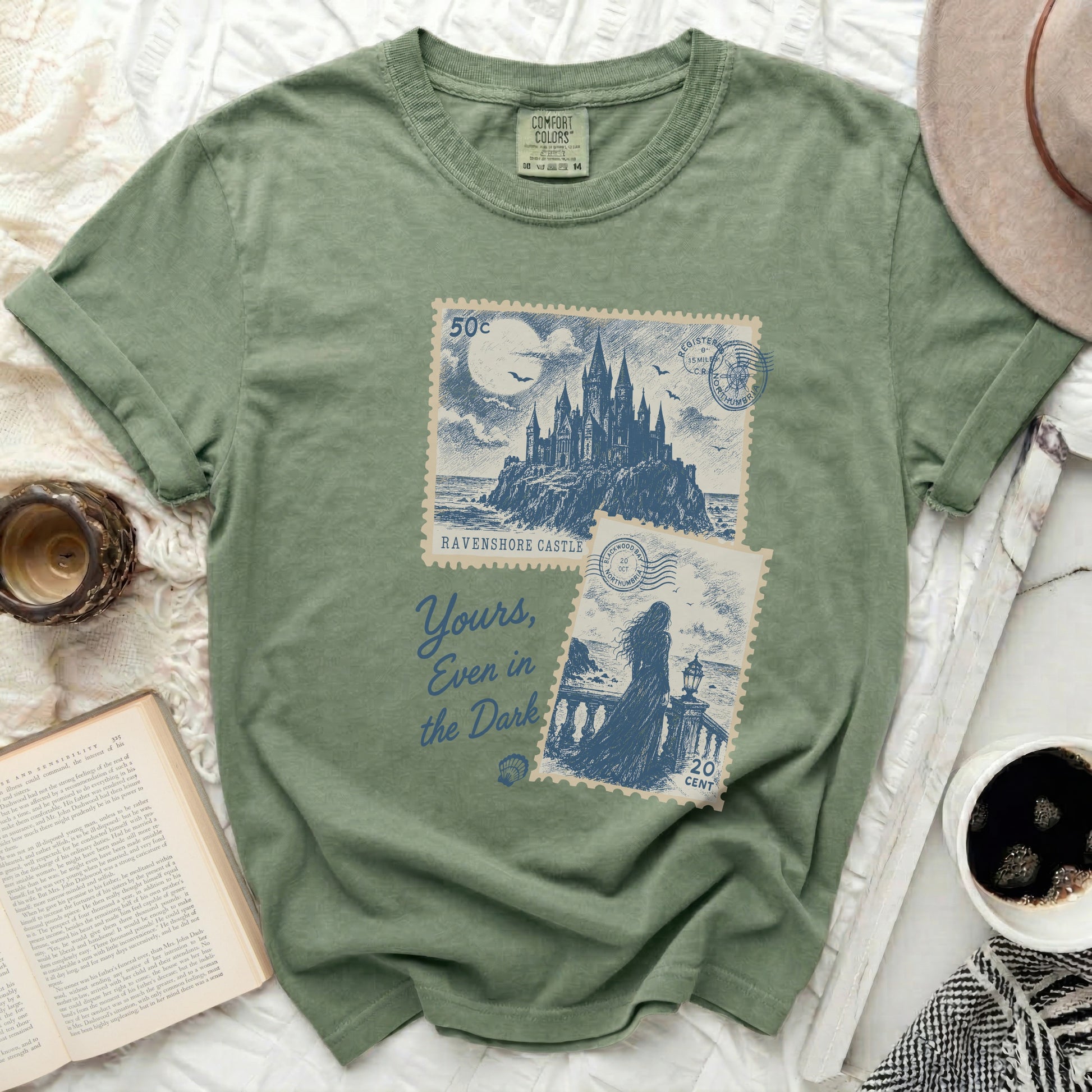 Sage green t-shirt with Ravenmore Castle and vintage postage stamp design.