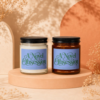 Two candles, one clear and one brown, with "A Novel Obsession" labels.