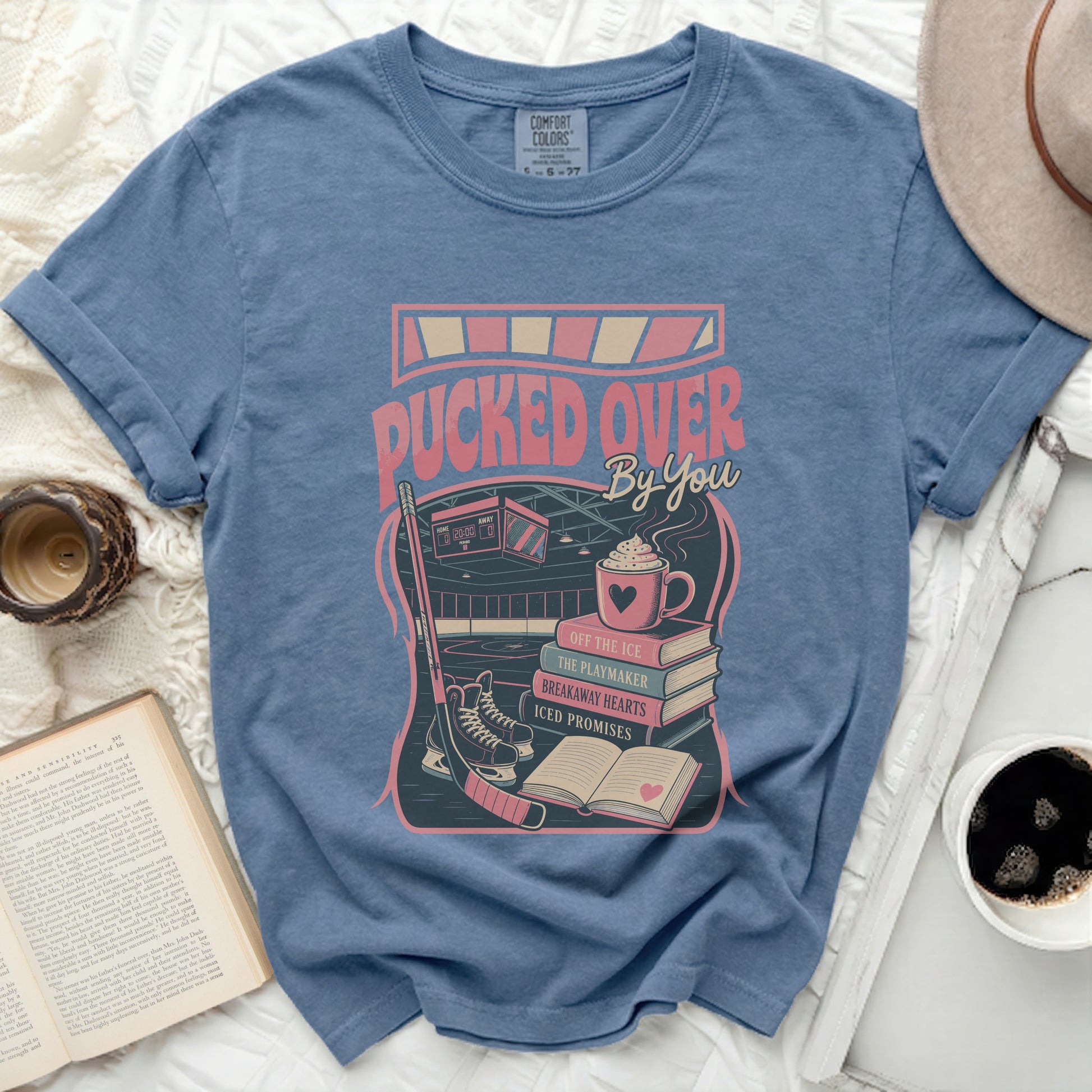 Blue t-shirt with "Pucked Over By You" text and hockey graphics.