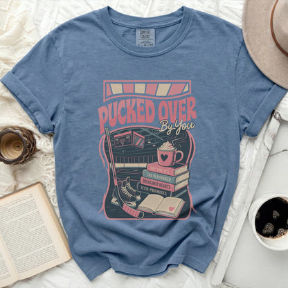 Blue t-shirt with "Pucked Over By You" text and hockey graphics.