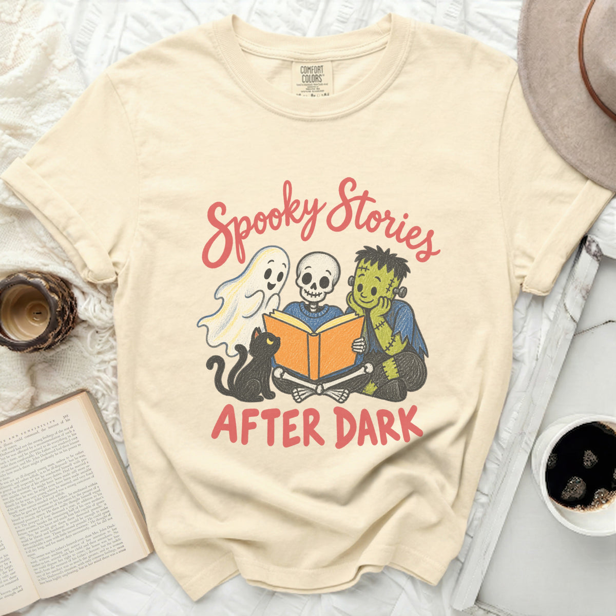 Cream Comfort Colors t-shirt with "Spooky Stories After Dark" text and Halloween characters reading.