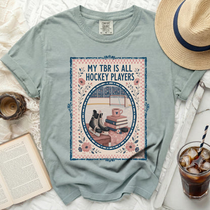 T-shirt with "My TBR is All Hockey Players" text and hockey rink illustration.