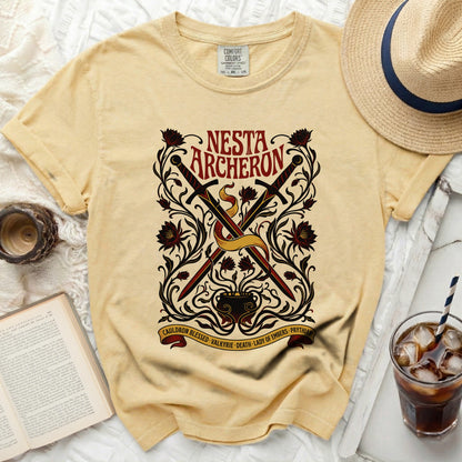 Yellow t-shirt with "Nesta Archerson" text and crossed swords design.