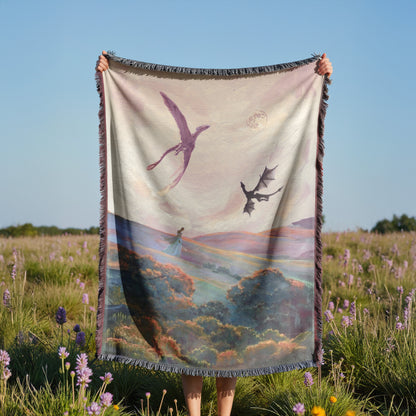 A person is holding a large blanket with a painting of a dragon and a woman in a field of flowers.