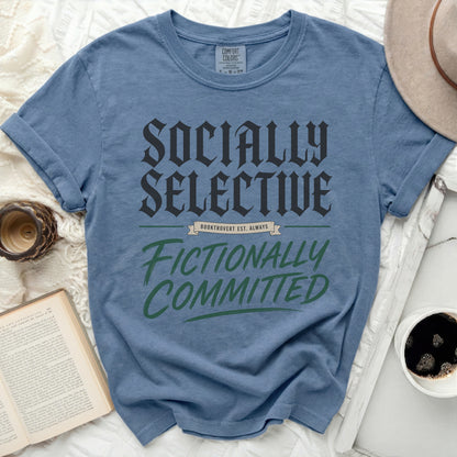 Blue t-shirt with "Socially Selective Fictionally Committed" text.