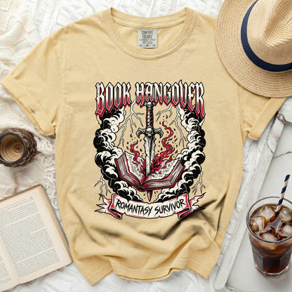 Yellow t-shirt with "Book Hangover Romantasy Survivor" graphic.