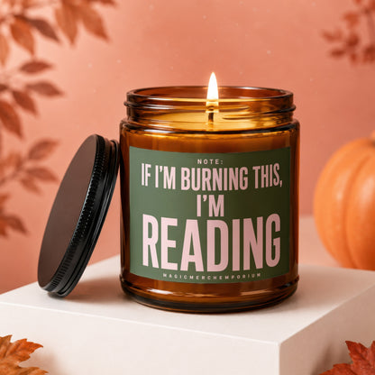 Amber jar candle with lid off, featuring text "Note: If I'm burning this, I'm reading".