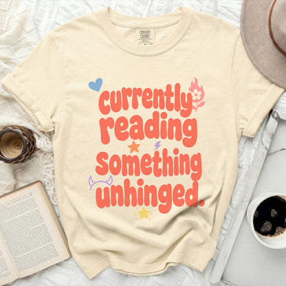 Comfort Colors t-shirt with "currently reading something unhinged" text and graphics.