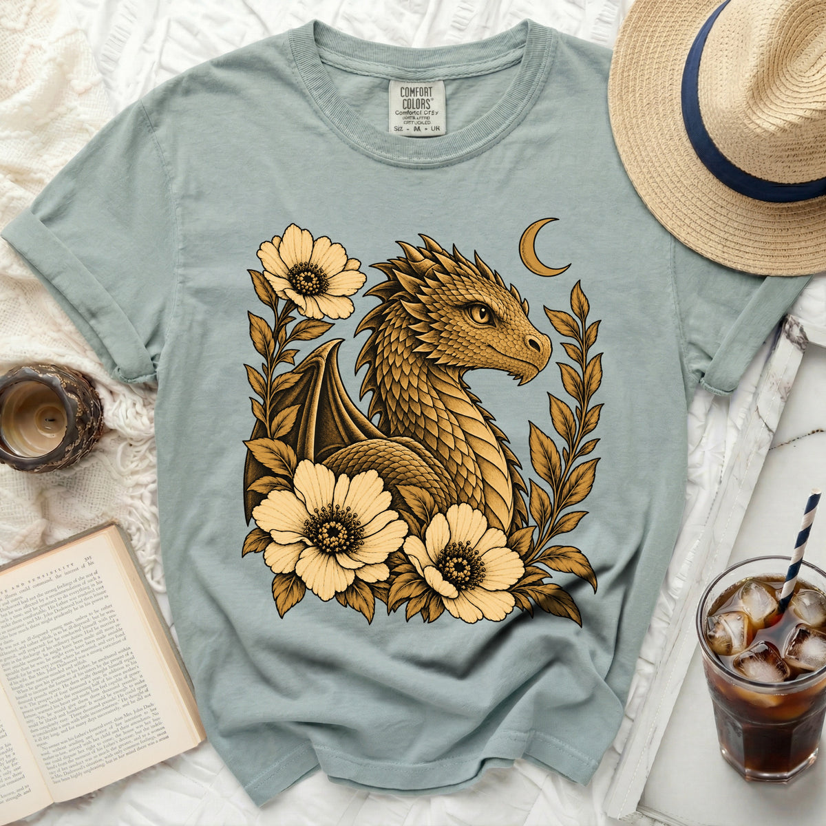 Sage t-shirt with golden dragon, flowers, and crescent moon graphic.