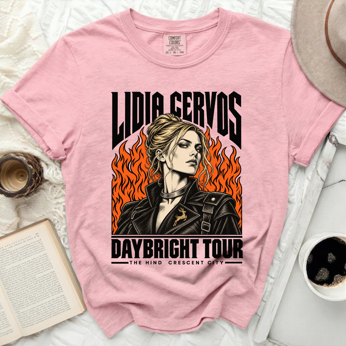 Pink t-shirt with "Lidia Cervos Daybright Tour" graphic of a woman with flames.