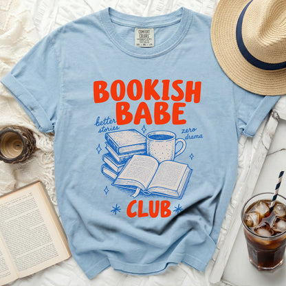 Light blue t-shirt with "BOOKISH BABE" and book graphics.