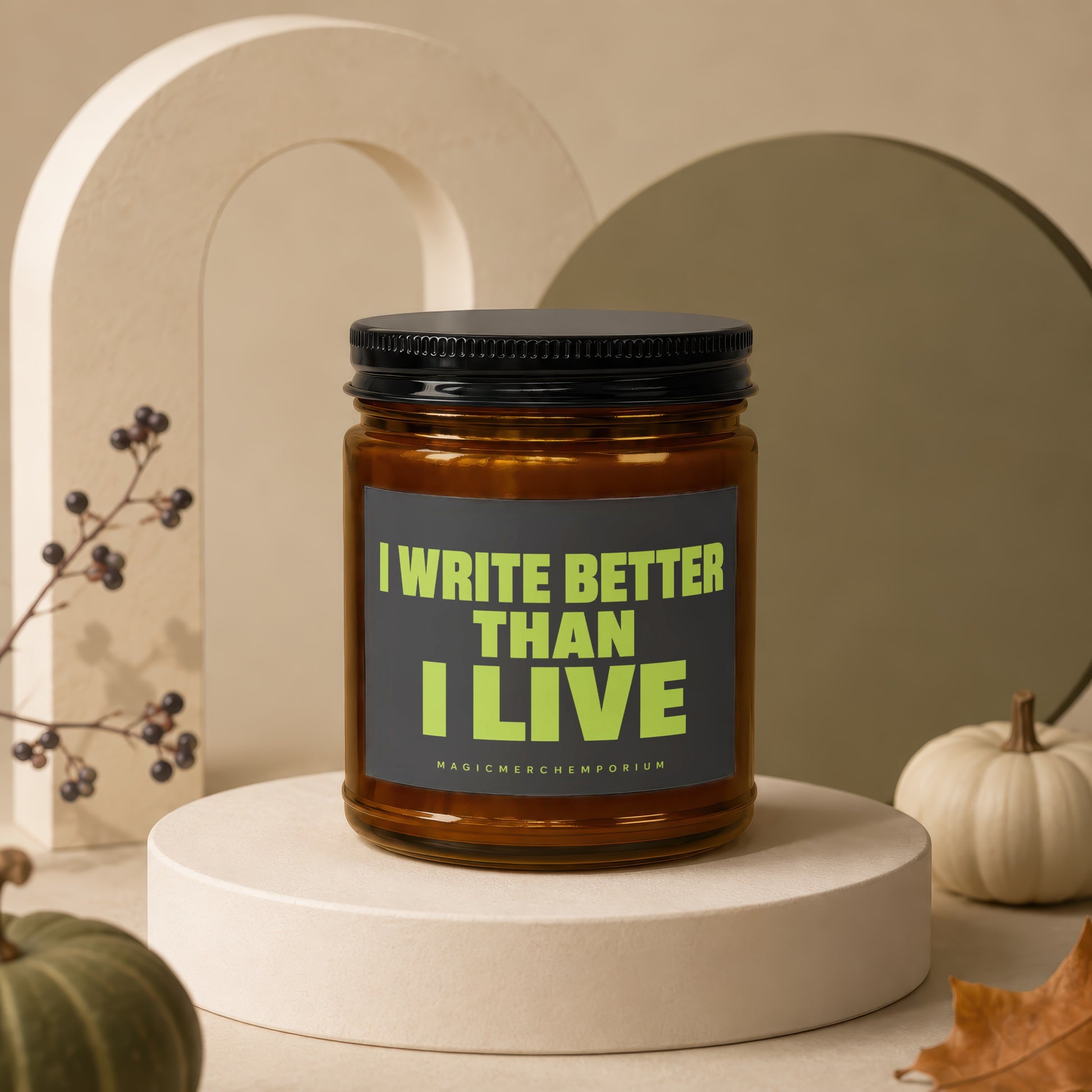 Amber jar candle with black lid, text reads "I WRITE BETTER THAN I LIVE".
