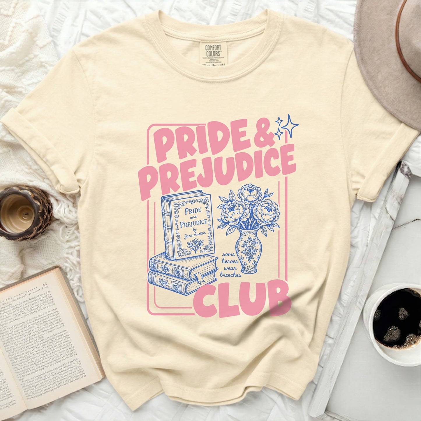 Pride and Prejudice Club graphic on a cream t-shirt with books.