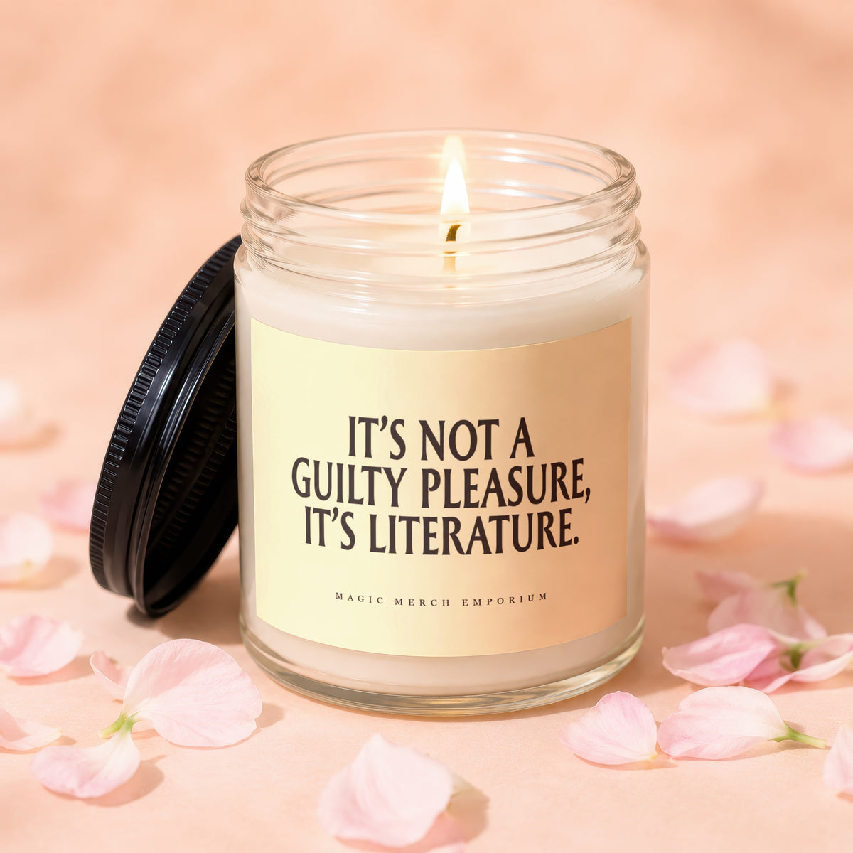 Candle with "It's Not A Guilty Pleasure, It's Literature" text and Magic Merch Emporium logo.