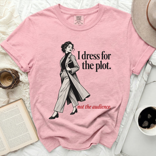Pink t-shirt with illustration and text: "I dress for the plot. not the audience."