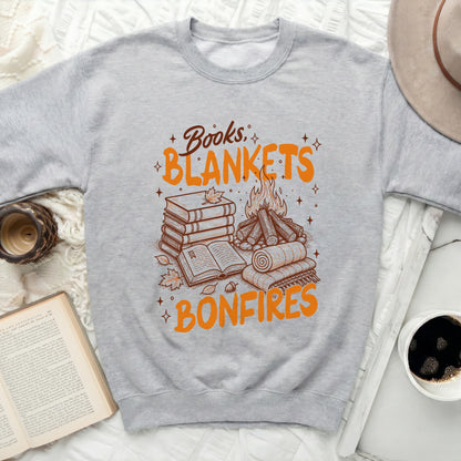 Gray sweatshirt with the text "Books, Blankets, Bonfires" and illustrations.