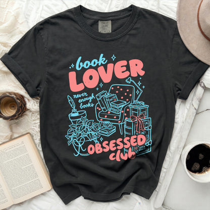 Black t-shirt with "book LOVER never enough books obsessed club" graphic.