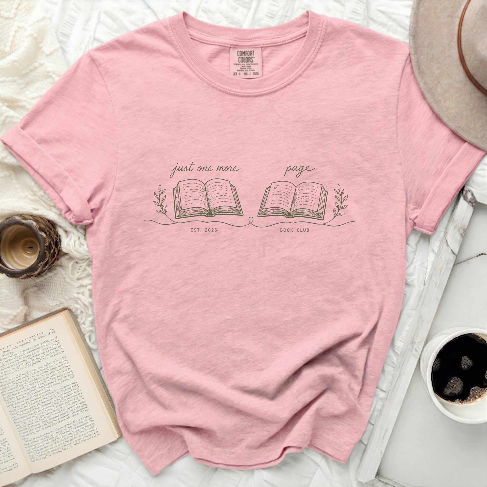 Pink t-shirt with "just one more page" book club design.