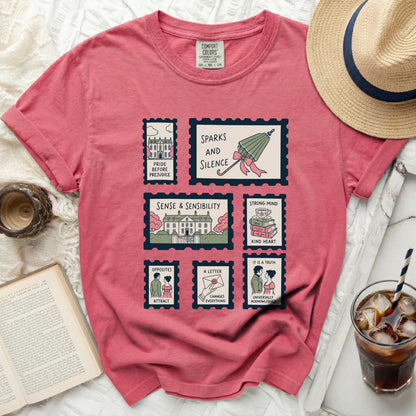 Coral Comfort Colors t-shirt with book-themed postage stamp graphic.
