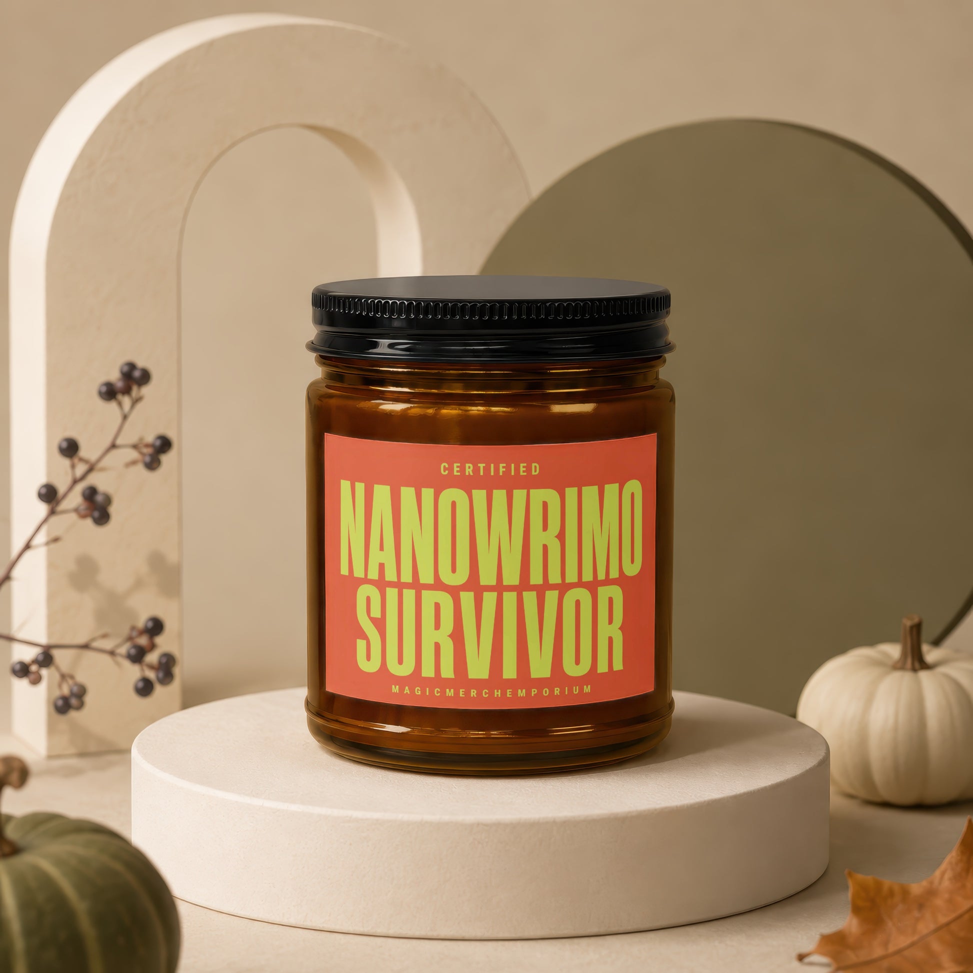Candle with "Certified Nanowrimo Survivor" text on orange label.