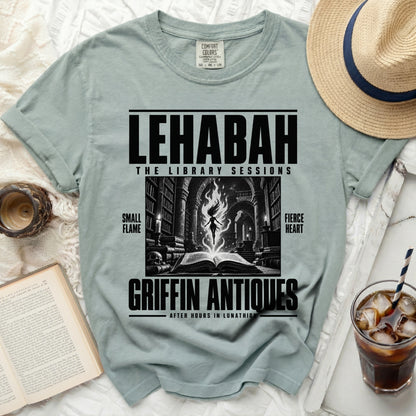 Pale green t-shirt with "LEHABAH THE LIBRARY SESSIONS" and dark illustration.