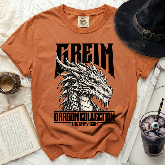 Orange t-shirt with a black dragon graphic, "FREIM" and "DRAGON COLLECTION THE EMPYREAN".